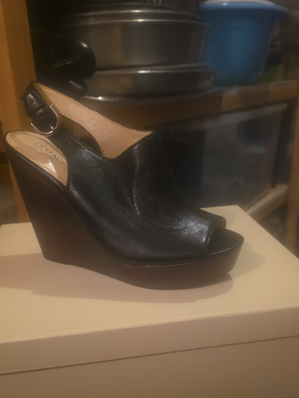 Coach Jade black leather peep-toe wedge sandals featuring a perforated